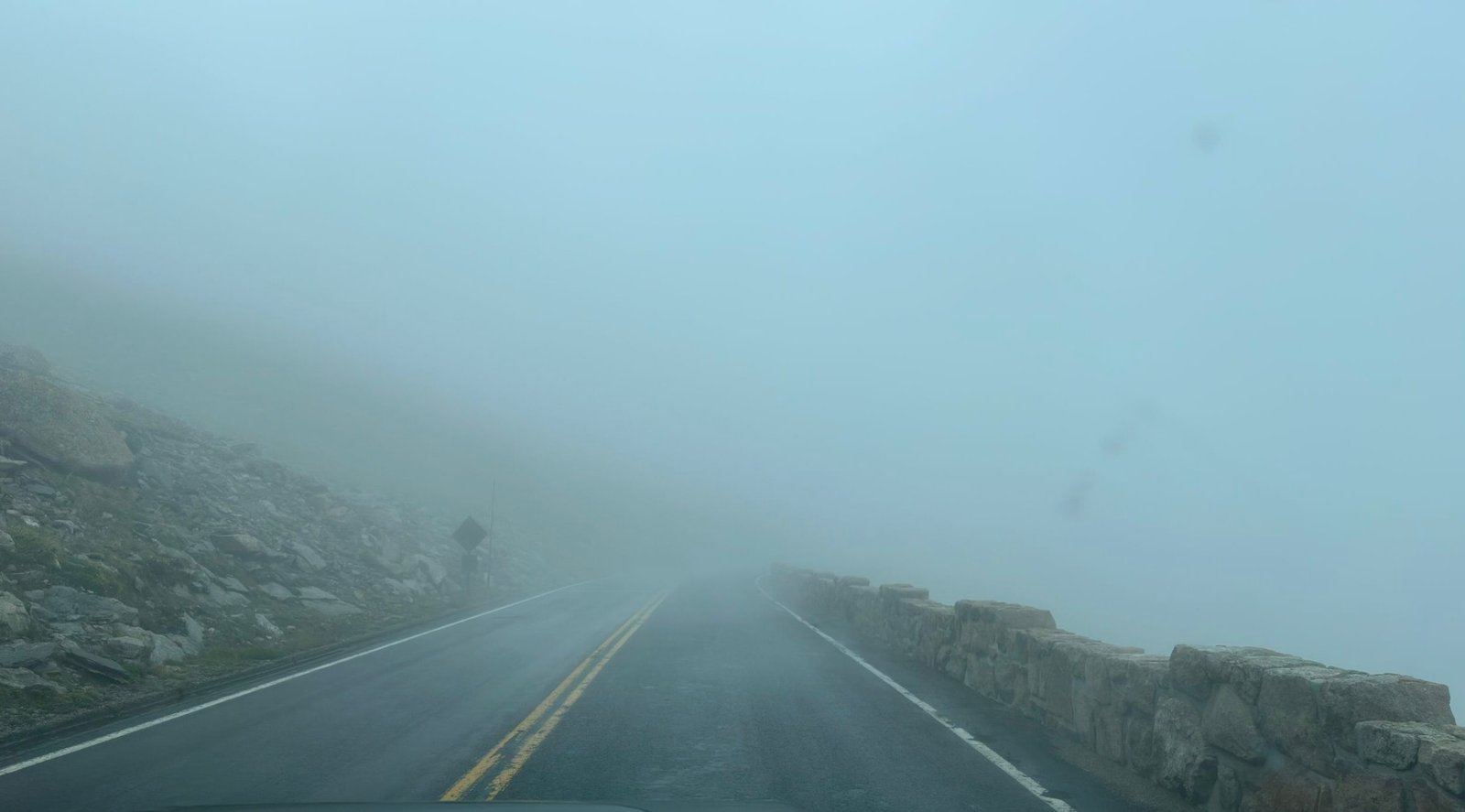 Driving up a road, into the fog